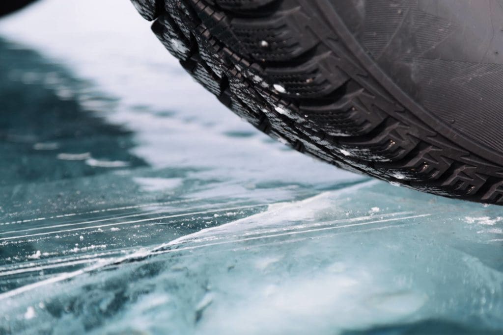 Black ice starts out wet and forms when temperatures decrease below freezing. Most often ice forms around shaded areas on the road or bridges, so the sun can’t melt it.
