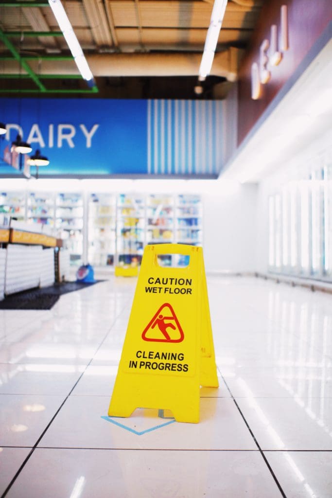 Proper signage for wet surfaces is part of a property owner's burden of care